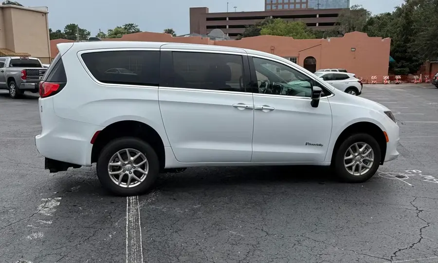 2025 Chrysler Voyager LX wheelchair accessible van Orlando, white exterior side view with BraunAbility branding